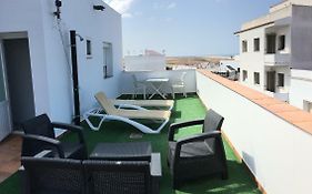 Arco - Virgen Apartamentos y Habitación